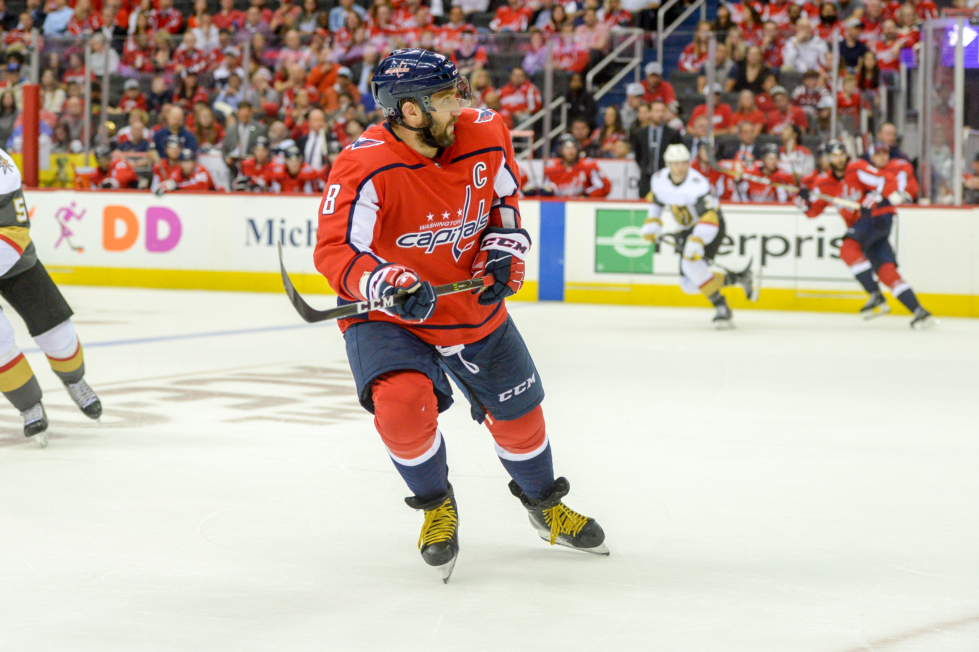 Alex Ovechkin in a red Washington Capitals jersey skating during a 2018 game.