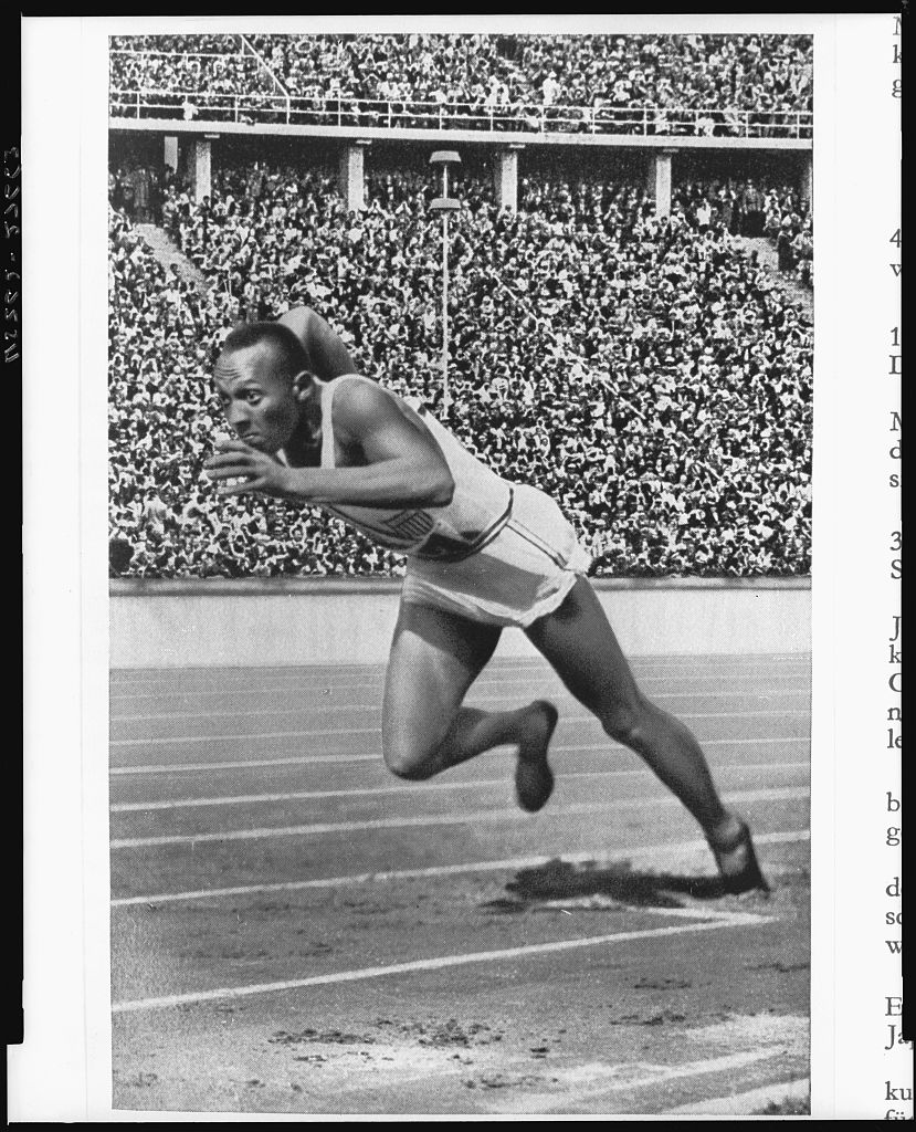 Jesse Owens launching into a sprint at the 1936 Berlin Olympics.