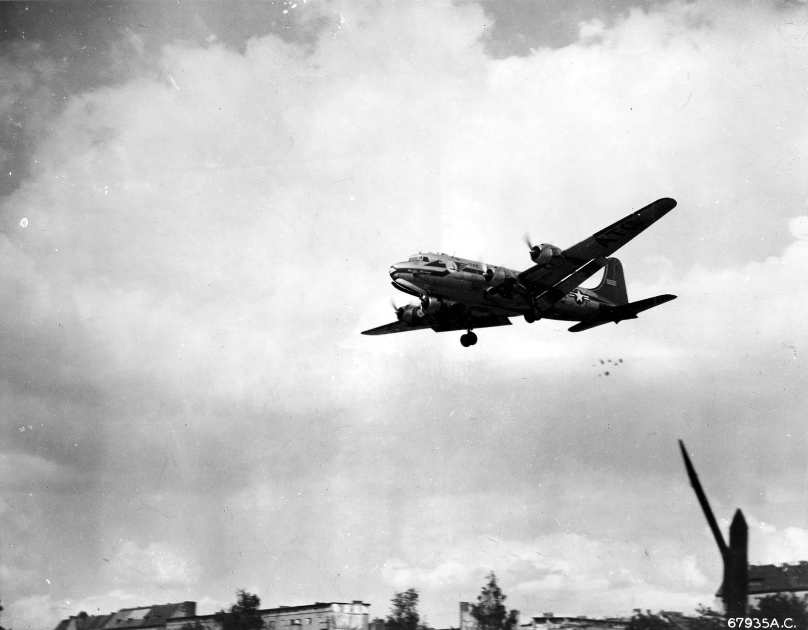 A C-54 drops candy parachutes during the Berlin Airlift, circa 1948–1949.