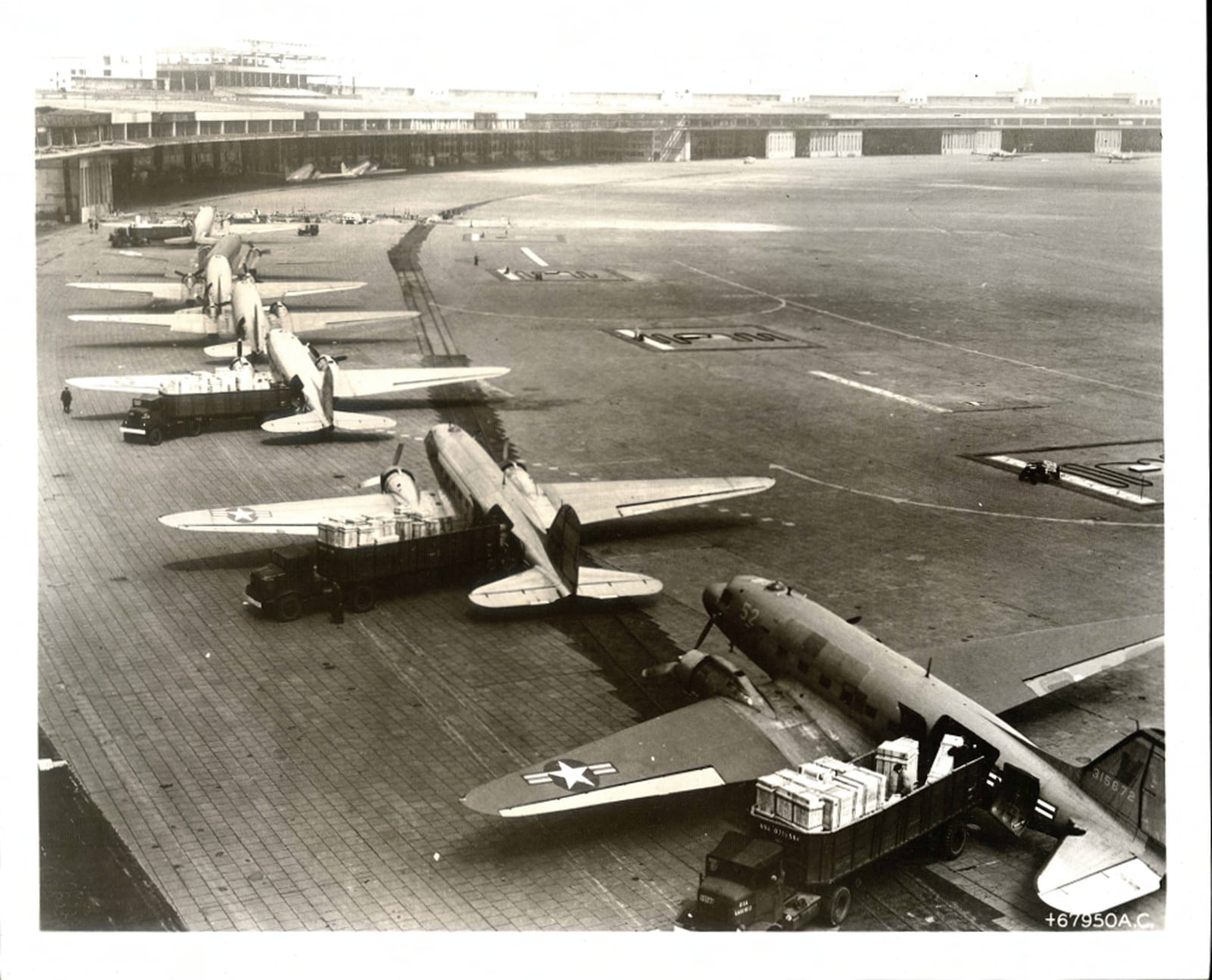 C-47 aircraft in the unloading line at Tempelhof during the Berlin Airlift, 1948–1949.